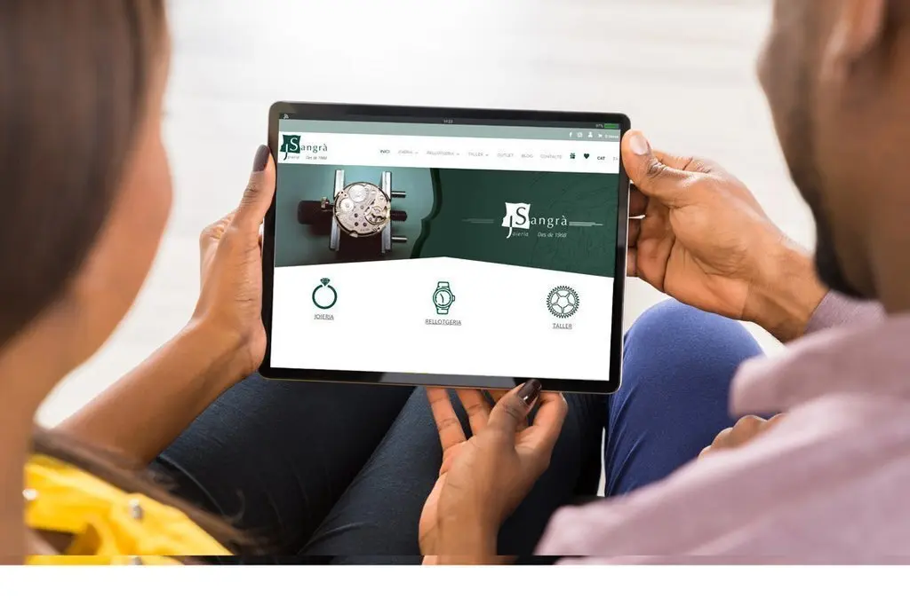 Close-up Of Young African Couple Using Digital Tablet