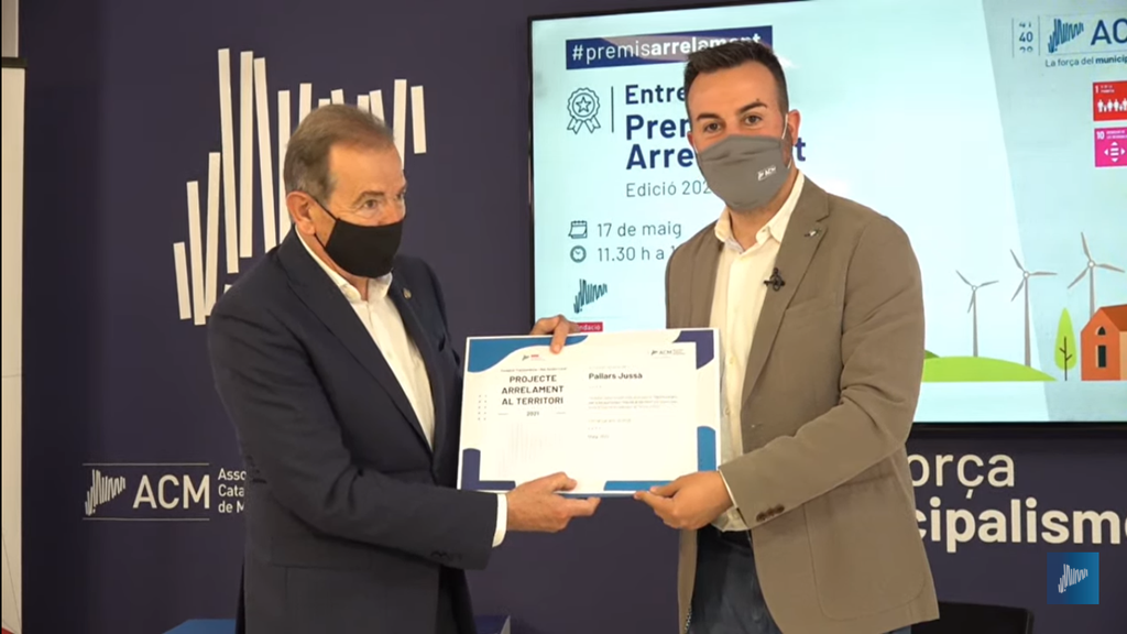 premi arrelament al territori