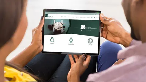 Close-up Of Young African Couple Using Digital Tablet