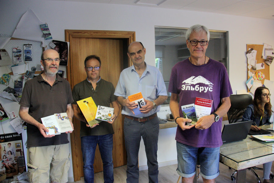 Pla americà, d'esquerra a dreta, de l'escriptor Joan Obiols, el director d'Edicions Salòria, Marcel·lí Pascual, el president de l'Associació del Llibre del Pirineu, Isidre Domenjó, i l'escriptor Manel Figuera, el 28 d'agost de 2019 (Horitzontal).